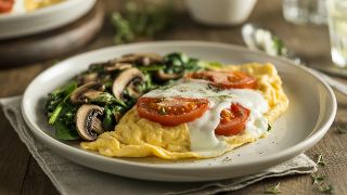 Cheese and Tomato Omelet with Sautéed Spinach and Mushrooms