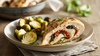 Stuffed Chicken Breast with Sun-Dried Tomato, Mozzarella, and Basil with Roasted Brussels Sprouts