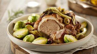 Slow-Braised Pork Shoulder with Lemon, Olives, and Fennel with Roasted Brussels Sprouts