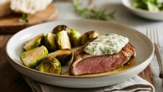 Pan-Seared Duck Breast with Herb Butter and Roasted Brussels Sprouts